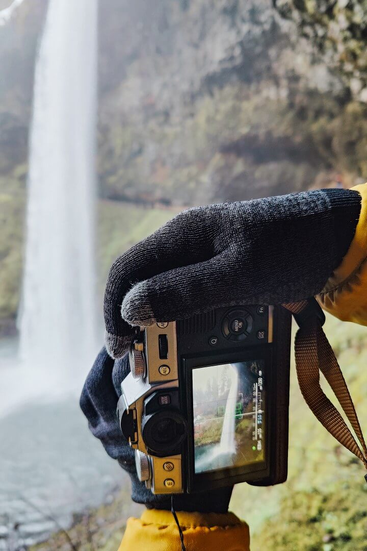 photographing waterfalls wearing Vessi waterproof cloves